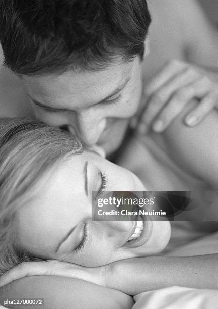 couple laying on bed, close-up, b&w - clara stock pictures, royalty-free photos & images