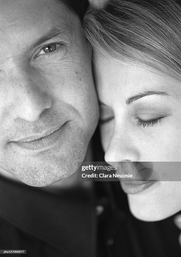 Couple hugging, close-up, b&w