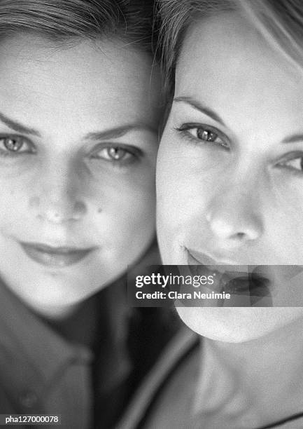 two women side by side, close-up, b&w - clara stock pictures, royalty-free photos & images