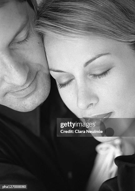 couple hugging, eyes closed, close-up, b&w - clara stock pictures, royalty-free photos & images