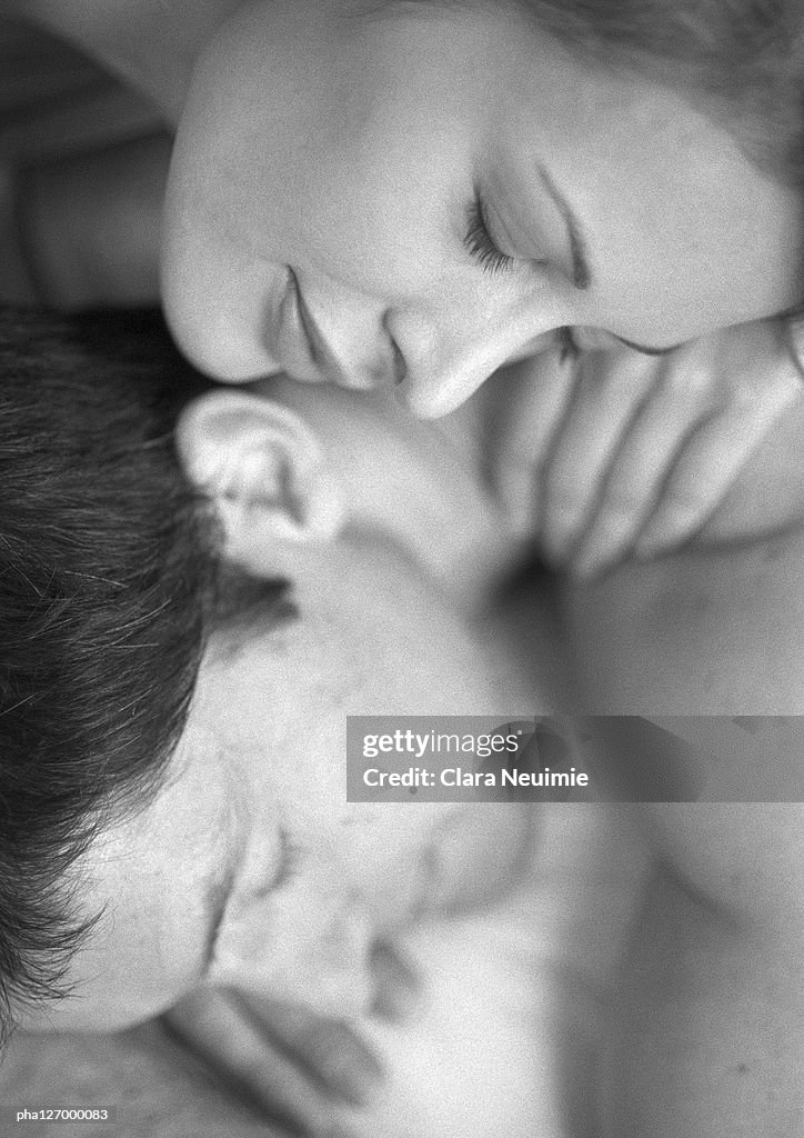 Couple hugging, close-up, b&w