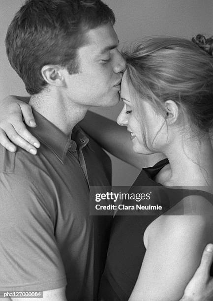 couple embracing, side view, b&w - clara stock pictures, royalty-free photos & images