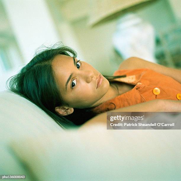 woman sitting with head rested against the back of chair - back of chair stock pictures, royalty-free photos & images