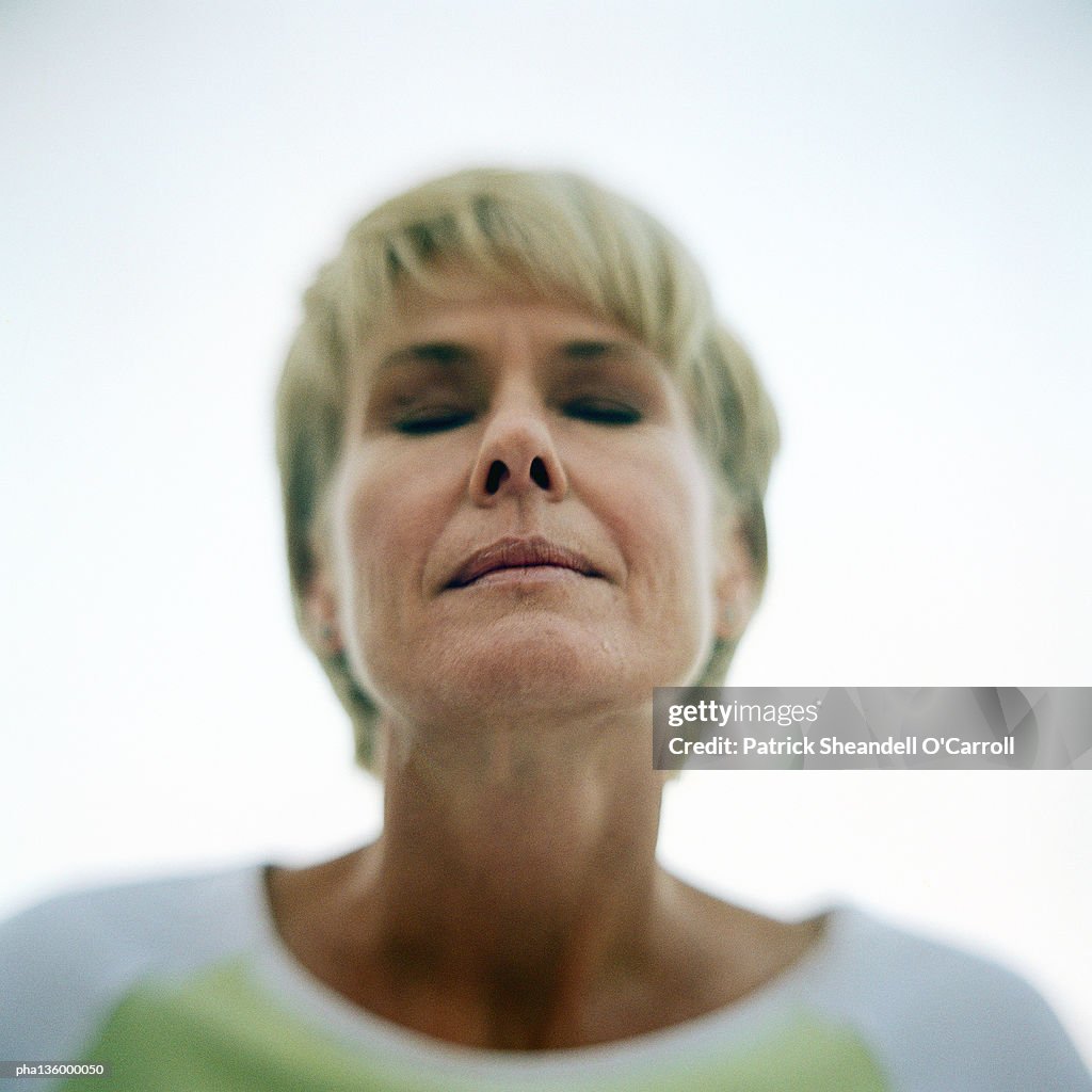 Portrait of senior woman, eyes shut