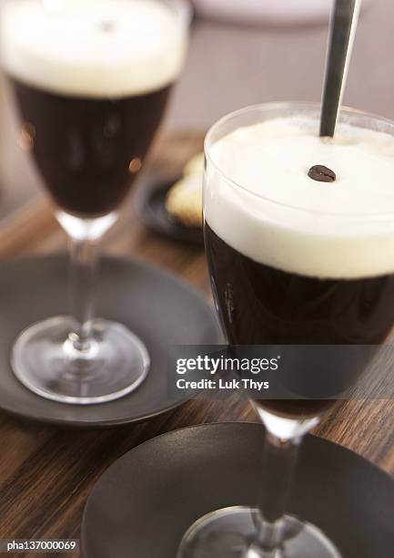 two glasses of irish coffee. - irish coffee stock-fotos und bilder
