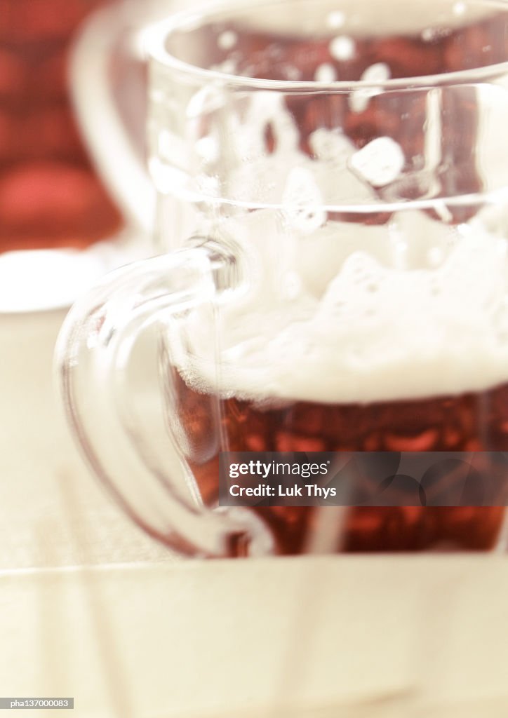 Half pint of beer, close-up.