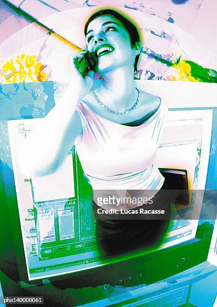 young woman using cell phone, emerging from computer monitor, digital composite. - commercial event stockfoto's en -beelden