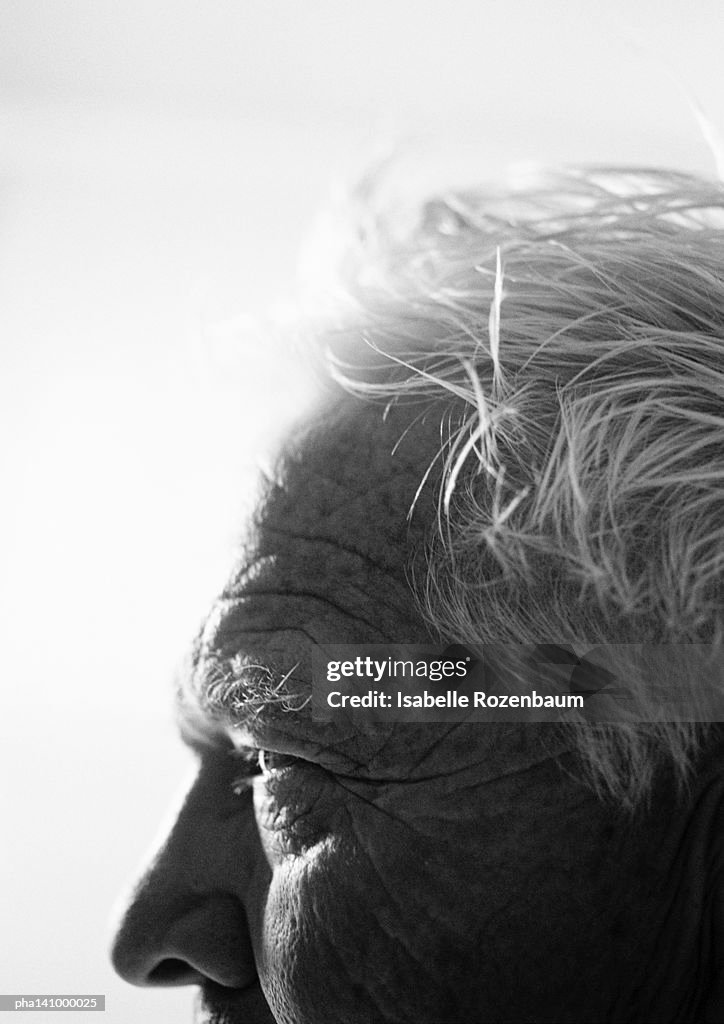 Senior man, close-up on forehead, side view.