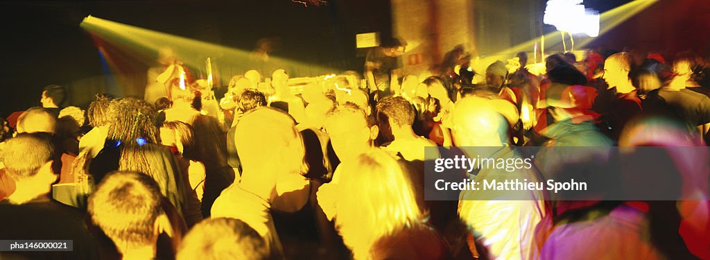 Crowd of people dancing at a nightclub