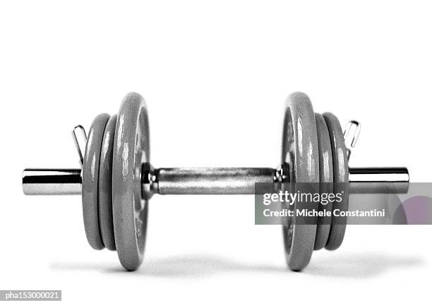 dumbbell and weights, b&w. - mancuerna fotografías e imágenes de stock