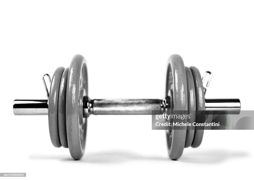 Dumbbell and weights, b&w.