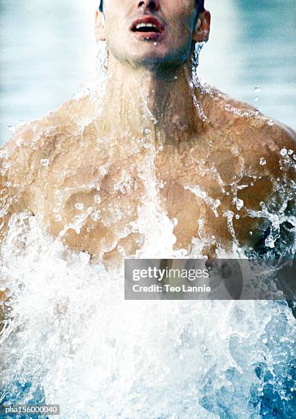 man coming out of water - people coming of age purify with icy water in tokyo stockfoto's en -beelden