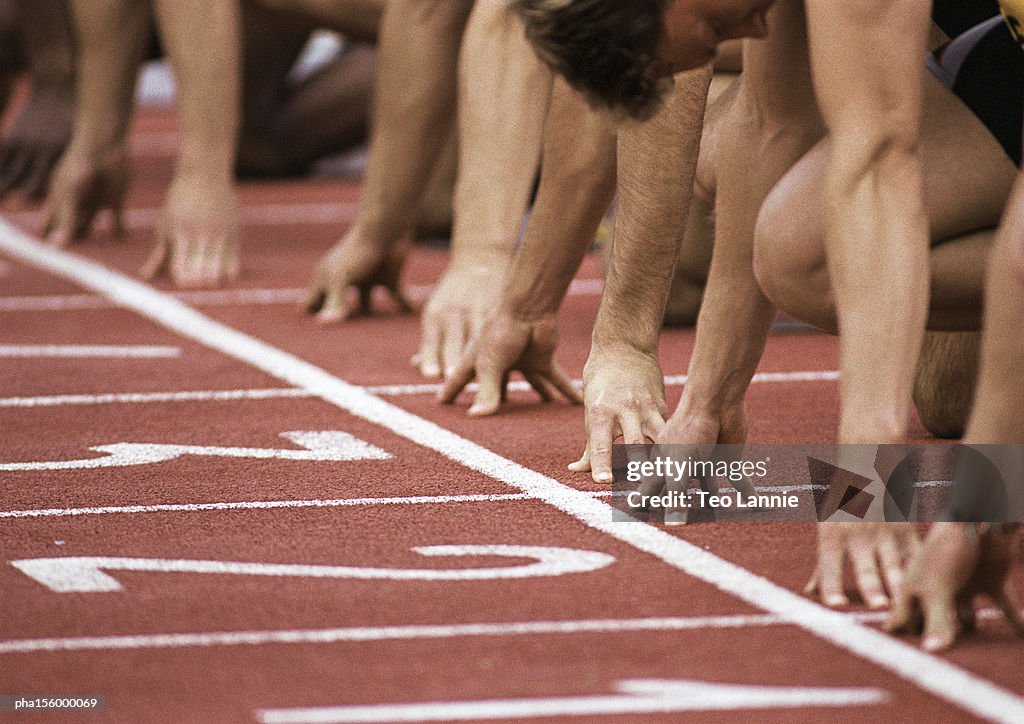 Male runners at start of race, close-up