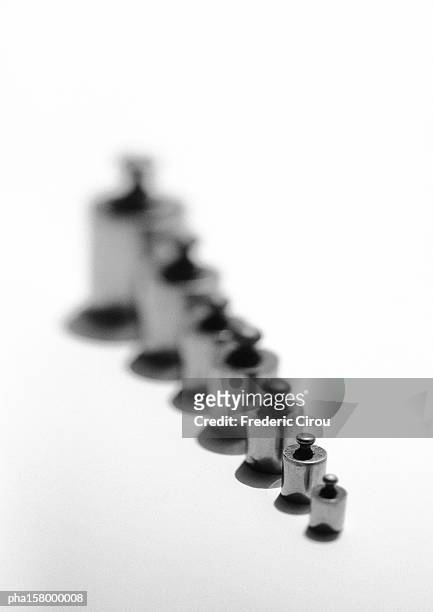 row of weights, b&w. - intersected stock pictures, royalty-free photos & images