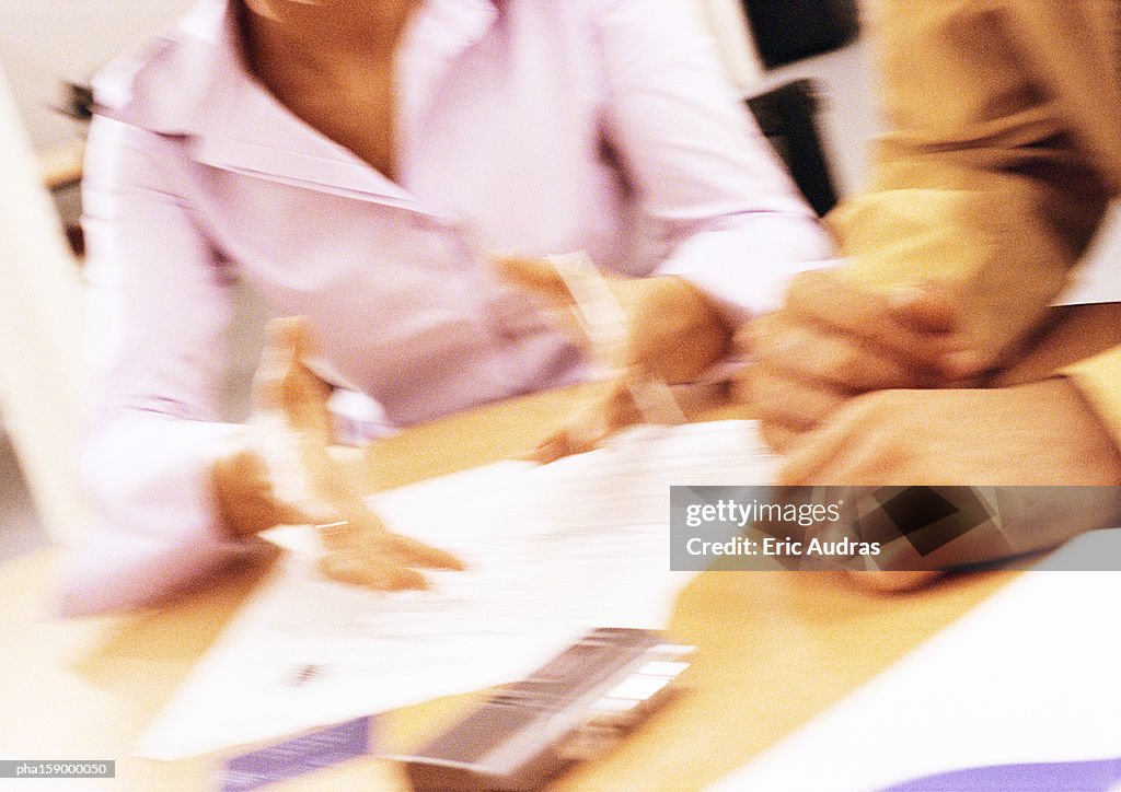 Workers discussing business, close-up.