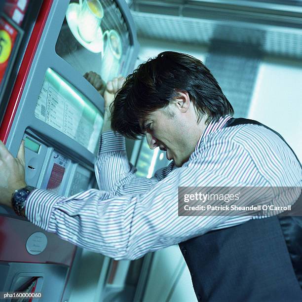 businessman looking distressed, side view. - o foto e immagini stock