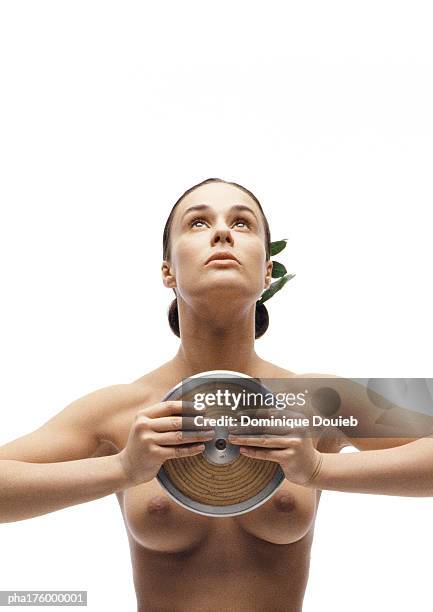 half-nude woman holding discus - womens field event stock pictures, royalty-free photos & images