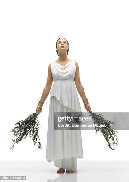 woman wearing toga - toga stock-fotos und bilder