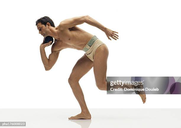 half-nude man throwing shot put - shot put stock pictures, royalty-free photos & images