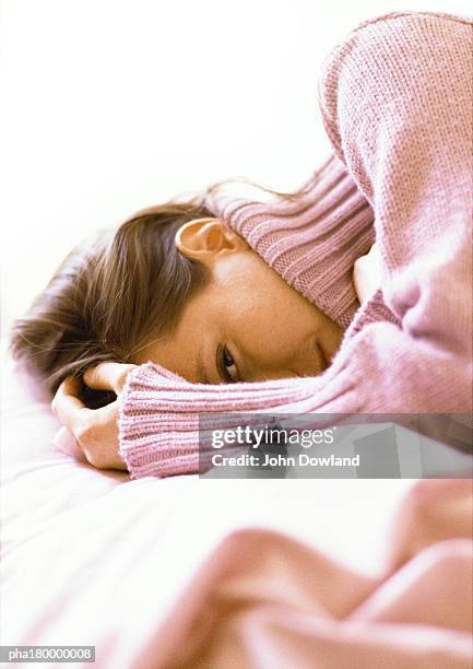 woman lying with hand on head, close-up - hand on head ストックフォトと画像