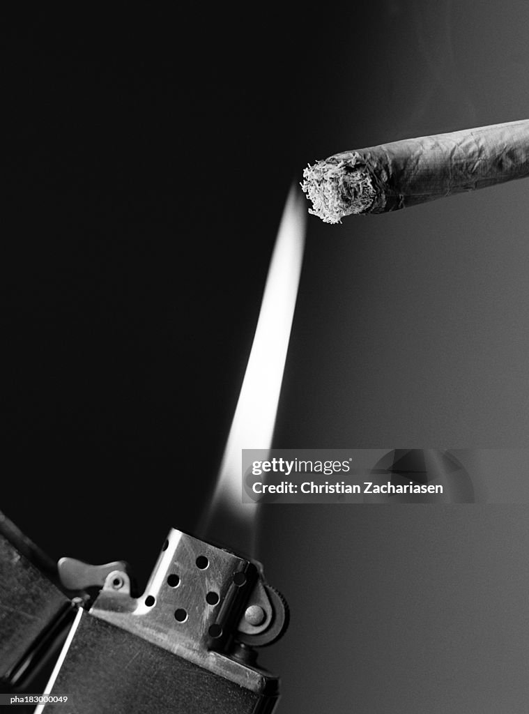 Lighter and cigarette, close-up, b&w