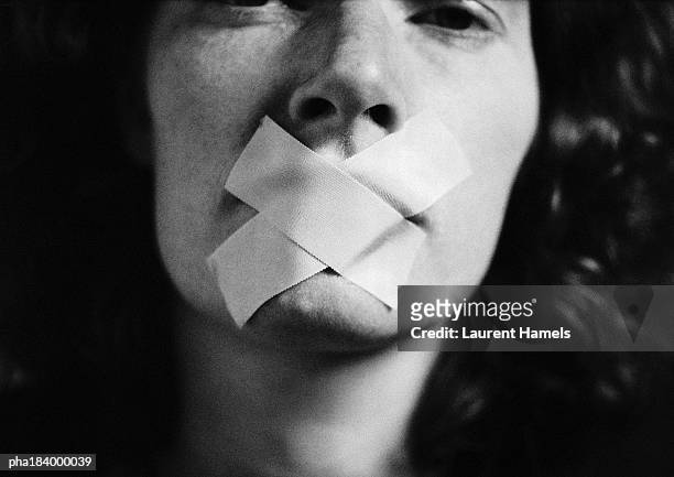 gagged woman, close-up, blurred - discrimination fotografías e imágenes de stock