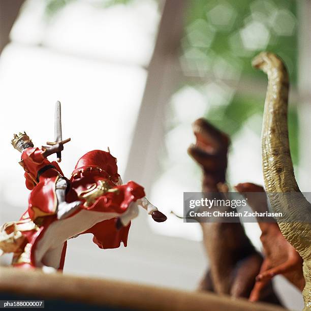 toy knight fighting against toy dinosaurs. - president trump hosts public safety medal of valor awards at white house stockfoto's en -beelden