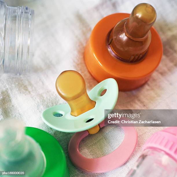 pacifiers and baby bottle top. - babys dummy stock pictures, royalty-free photos & images