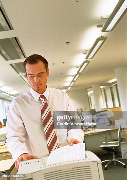 businessman using copy machine. - printer frustration stock pictures, royalty-free photos & images