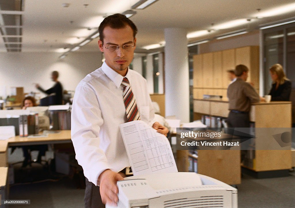 Businessman working in office.