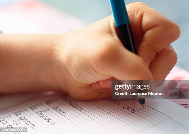 textbook and ballpoint  pen. - spelling fotografías e imágenes de stock