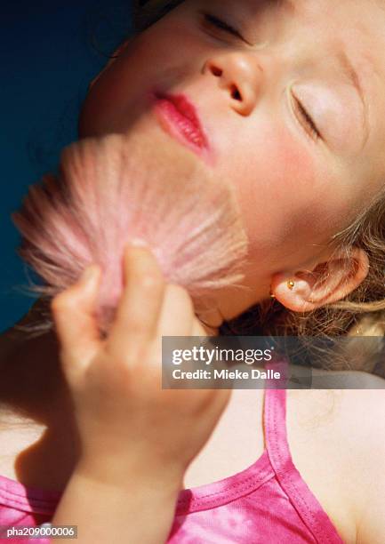 little girl with make-up brush, portrait. - make up ストックフォトと画像