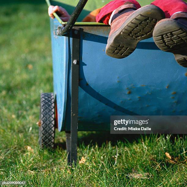 feet sticking out of a cart. - flora condition stock pictures, royalty-free photos & images