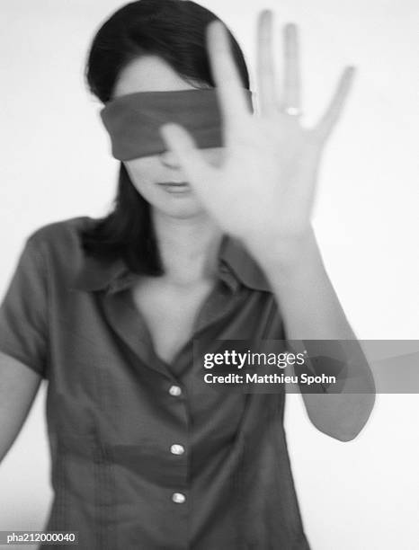 woman with a blindfold, hand held out, b&w. - bronwen smith of b floral and the today shows lilliana vazquez host a private floral accessories event in nyc stockfoto's en -beelden