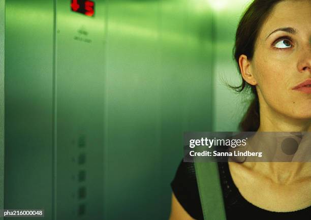 woman in an elevator, head and shoulders, partial view, close-up. - phobia foto e immagini stock