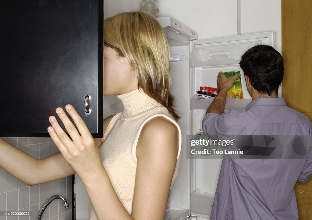 Young couple in the kitchen.