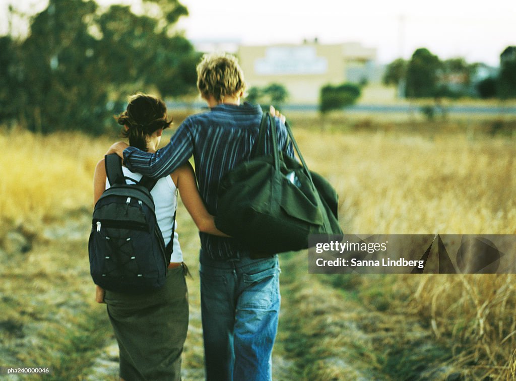 Couple walking, rear view