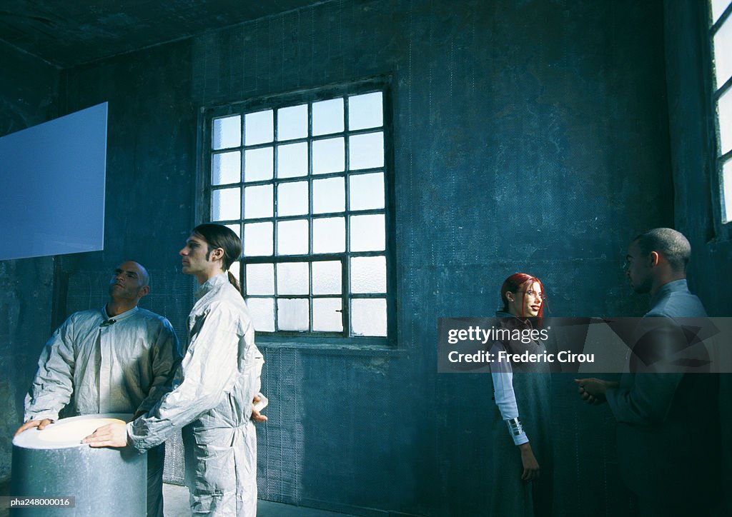 Group of people standing in a room