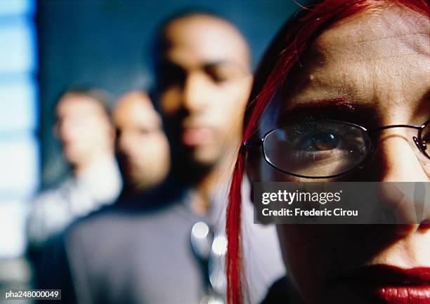 people standing in line, focus on woman's face - intersected stock pictures, royalty-free photos & images