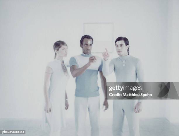 three people looking at square frame - being watched stockfoto's en -beelden