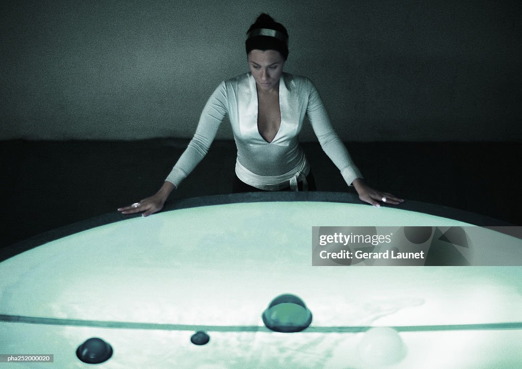 Woman with hands on table, high angle view