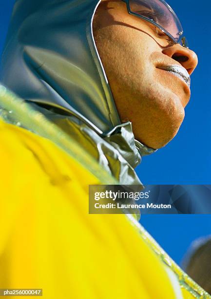 person wearing protective suit, low angle view, close-up - africain stockfoto's en -beelden