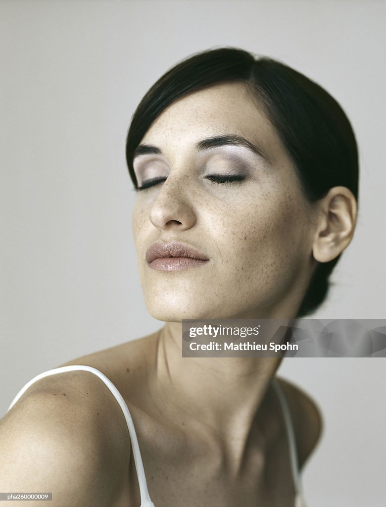 Woman with eyes closed, portrait