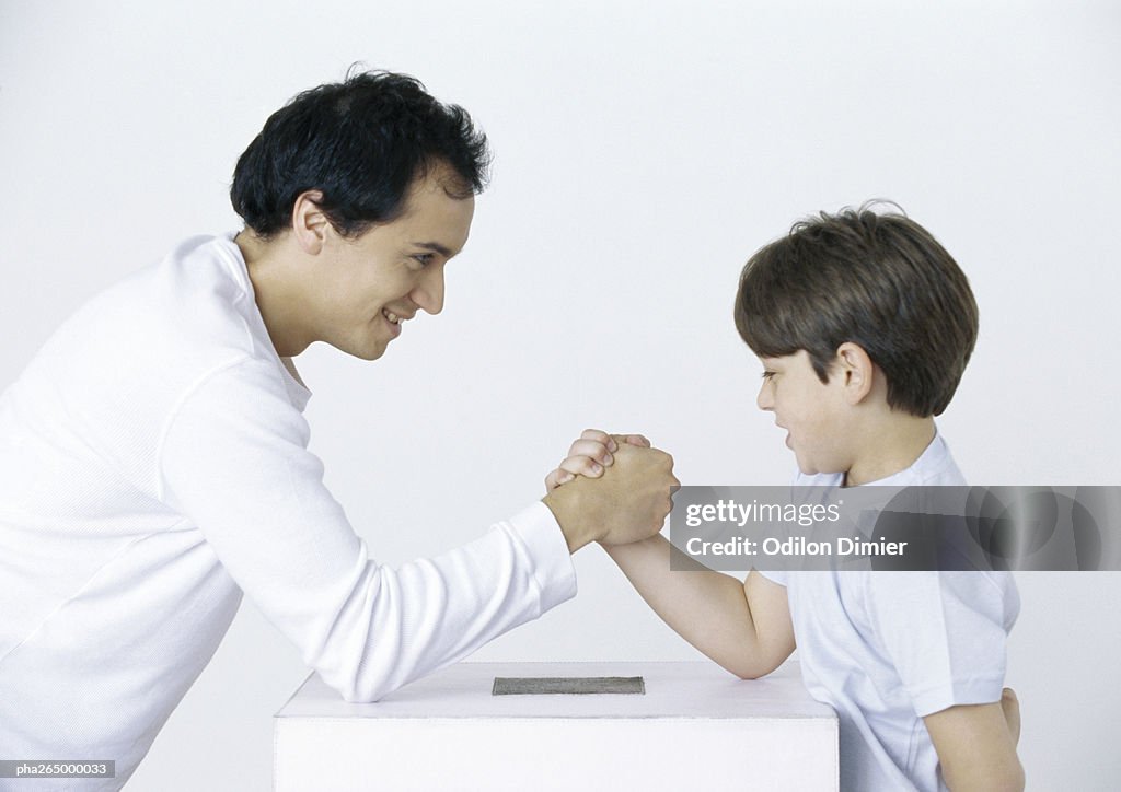 Father and son armwrestling