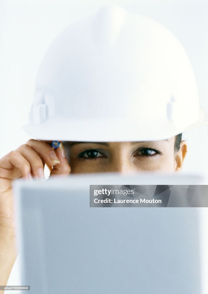Woman Head Over Computer Screen Woman Wearing Hard Hat Looking Over Computer Screen High-Res Stock ...