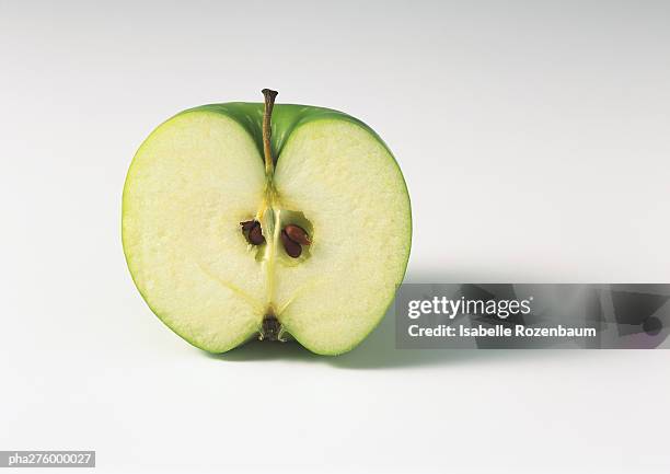 apple half - green apple slices stock pictures, royalty-free photos & images
