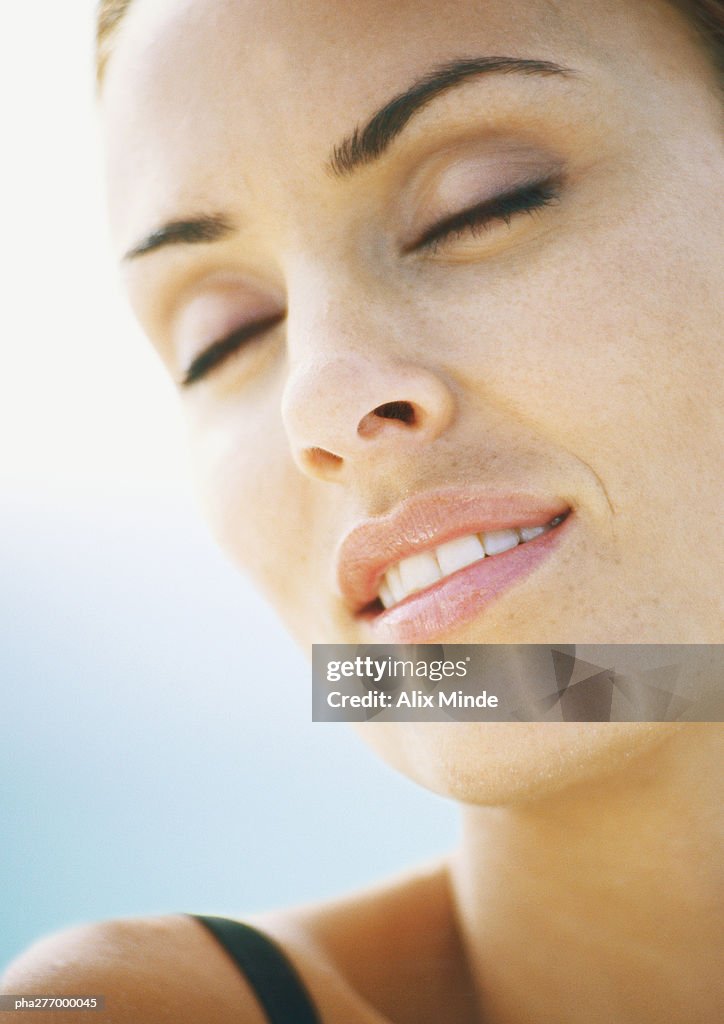 Woman's face with eyes closed, close-up