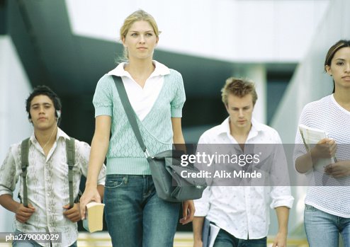 Students walking, front view Students walking, front view
