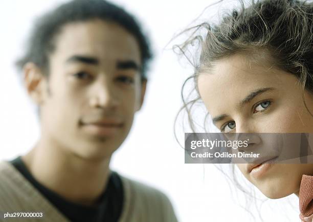 young couple, looking at camera, close-up - depth of field togetherness looking at the camera ストックフォトと画像