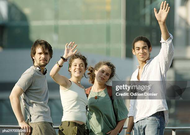 group of young people waving - four people walking away stock pictures, royalty-free photos & images